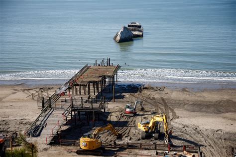 Crews demolish historic Monterey Bay pier, in danger of collapse after January storm damage